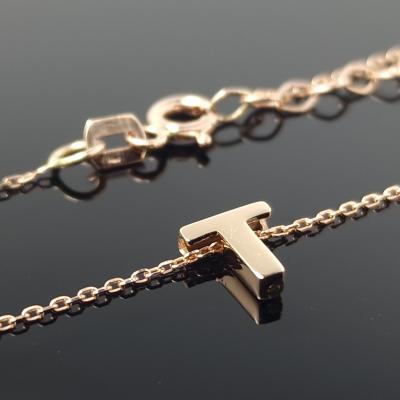 Auksinė grandinėlė su raidele T