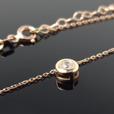 Auksinė grandinėlė su balta akute