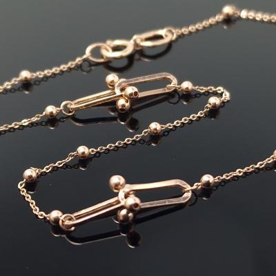 Auksinė grandinėlė su pakabukais