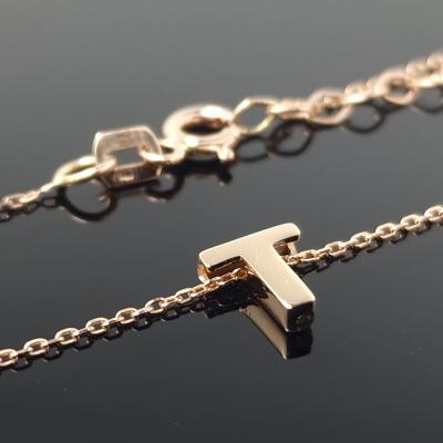 Auksinė grandinėlė su raidele T