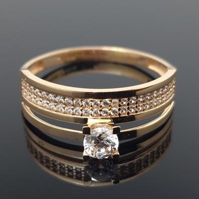 Dvigubas auksinis žiedas su akutėmis