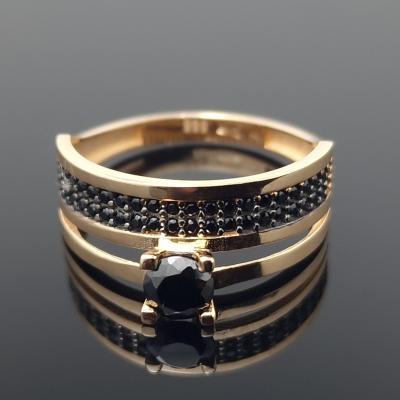 Dvigubas auksinis žiedas su akutėmis