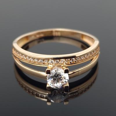 Dvigubas auksinis žiedas su akutėmis