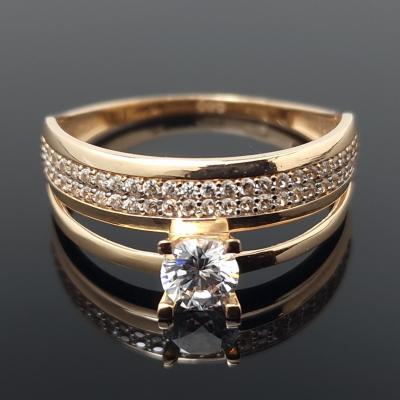 Dvigubas auksinis žiedas su akutėmis