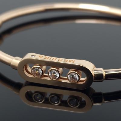 Auksinė apyrankė su akutėmis